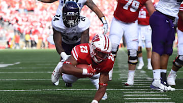 MADISON, WI - SEPTEMBER 30: Jonathan Taylor #23 of the Wisconsin Badgers dives for a touchdown during the first quarter of a game against the Northwestern Wildcats at Camp Randall Stadium on September 30, 2017 in Madison, Wisconsin. (Photo by Stacy Revere/Getty Images)