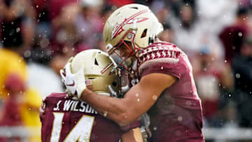 Aug 27, 2022; Tallahassee, Florida, USA; Florida State Seminoles wide receiver Mycah Pittman (4) celebrates with Johnny Wilson (14) after a big play during the first half against the Duquesne Dukes at Doak S. Campbell Stadium. Mandatory Credit: Melina Myers-USA TODAY Sports