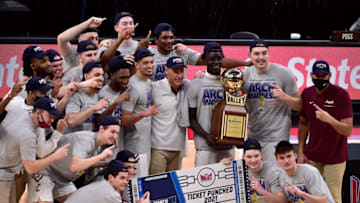 Mar 7, 2021; St. Louis, Missouri, USA; Loyola Ramblers pose for a photo after defeating the Drake Bulldogs in the finals of the Missouri Valley Conference Tournament at Enterprise Center. Mandatory Credit: Jeff Curry-USA TODAY Sports