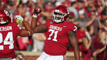 NORMAN, OK - NOVEMBER 25: Oklahoma Sooners OL Bobby Evans (71) celebrates after a touchdown during a college football game between the Oklahoma Sooners and the West Virginia Mountaineers on November 25, 2017, at Memorial Stadium in Norman, OK. (Photo by David Stacy/Icon Sportswire via Getty Images)