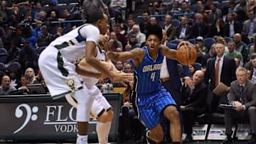 MILWAUKEE, WI - NOVEMBER 21: Elfrid Payton #4 of the Orlando Magic drives to the basket against John Henson #31 of the Milwaukee Bucks during a game at the BMO Harris Bradley Center on November 21, 2016 in Milwaukee, Wisconsin. Milwaukee defeated Orlando 93-89. NOTE TO USER: User expressly acknowledges and agrees that, by downloading and or using this photograph, User is consenting to the terms and conditions of the Getty Images License Agreement. (Photo by Stacy Revere/Getty Images)