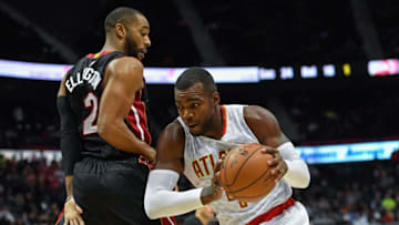 Dec 7, 2016; Atlanta, GA, USA; Atlanta Hawks forward Paul Millsap (4) drives the ball past Miami Heat guard Wayne Ellington (2) during the second half at Philips Arena. The Hawks defeated the Heat 103-95. Mandatory Credit: Dale Zanine-USA TODAY Sports