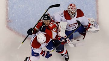 SUNRISE, FL - DECEMBER 29: Goaltender Carey Price #31 of the Montreal Canadiens defends the net with the help of teammate Ben Chiarot #8 against Evgeni Dadonov #63 of the Florida Panthers at the BB&T Center on December 29, 2019 in Sunrise, Florida. (Photo by Eliot J. Schechter/NHLI via Getty Images)