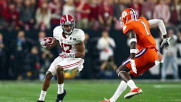 Jan 11, 2016; Glendale, AZ, USA; Alabama Crimson Tide running back Kenyan Drake (17) runs against Clemson Tigers safety Jayron Kearse (1) in the first quarter in the 2016 CFP National Championship at University of Phoenix Stadium. Mandatory Credit: Mark J. Rebilas-USA TODAY Sports