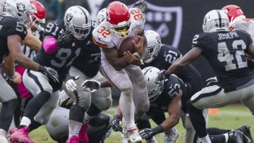 Oct 16, 2016; Oakland, CA, USA; Kansas City Chiefs running back Spencer Ware (32) carries the ball against the Oakland Raiders during the fourth quarter at Oakland Coliseum. The Kansas City Chiefs defeated the Oakland Raiders 26-10. Mandatory Credit: Kelley L Cox-USA TODAY Sports