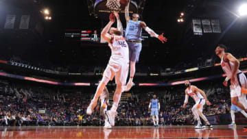 PHOENIX, AZ - DECEMBER 11: Ja Morant #12 of the Memphis Grizzlies shoots the ball against the Phoenix Suns on December 11, 2019 at Talking Stick Resort Arena in Phoenix, Arizona. NOTE TO USER: User expressly acknowledges and agrees that, by downloading and or using this photograph, user is consenting to the terms and conditions of the Getty Images License Agreement. Mandatory Copyright Notice: Copyright 2019 NBAE (Photo by Barry Gossage/NBAE via Getty Images)