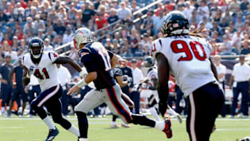 FOXBORO, MA - SEPTEMBER 24: Houston Texans defenders close in on Tom Brady (Photo by Jim Rogash/Getty Images)