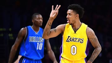 LOS ANGELES, CA - DECEMBER 29: Nick Young #0 of the Los Angeles Lakers reactst to his three pointer in front of Dorian Finney-Smith #10 of the Dallas Mavericks during the first half at Staples Center on December 29, 2016 in Los Angeles, California. NOTE TO USER: User expressly acknowledges and agrees that, by downloading and or using this photograph, User is consenting to the terms and conditions of the Getty Images License Agreement. (Photo by Harry How/Getty Images)