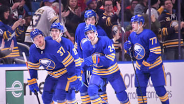 Nov 15, 2022; Buffalo, New York, USA; Buffalo Sabres center Casey Mittelstadt (37) looks to the video board after scoring a goal against the Vancouver Canucks in the third period at KeyBank Center. Mandatory Credit: Mark Konezny-USA TODAY Sports