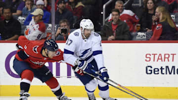 WASHINGTON, DC - MARCH 20: Alex Killorn #17 of the Tampa Bay Lightning skates with the puck against Nick Jensen #3 of the Washington Capitals in the second period at Capital One Arena on March 20, 2019 in Washington, DC. (Photo by Patrick McDermott/NHLI via Getty Images)