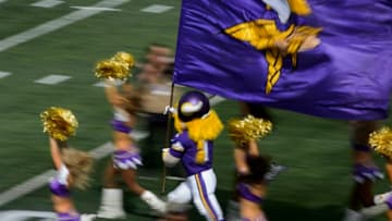 MINNEAPOLIS, MN - SEPTEMBER 20: Viktor, mascot for the Minnesota Vikings runs onto the field with the cheerleaders before the game between the Minnesota Vikings and the Detroit Lions on August 20, 2015 at TCF Bank Stadium in Minneapolis, Minnesota. The Vikings defeated the Lions 26-16. (Photo by Hannah Foslien/Getty Images)