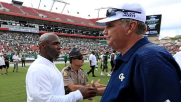 TAMPA, FL - SEPTEMBER 08: Head coach Charlie Strong of the South Florida Bulls and head coach Paul Johnson of the Georgia Tech Yellow Jackets shake hands following a game at Raymond James Stadium on September 8, 2018 in Tampa, Florida. (Photo by Mike Ehrmann/Getty Images)