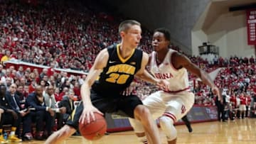Mar 3, 2015; Bloomington, IN, USA; Iowa Hawkeyes forward Jarrod Uthoff (20) drives to the basket against Indiana Hoosiers guard Yogi Ferrell (11) at Assembly Hall. Iowa defeats Indiana 77-63. Mandatory Credit: Brian Spurlock-USA TODAY Sports