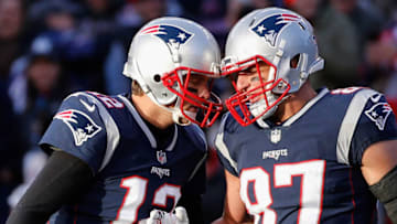 FOXBORO, MA - NOVEMBER 26: Tom Brady #12 reacts with Rob Gronkowski #87 of the New England Patriots after a touchdown during the third quarter of a game against the Miami Dolphins at Gillette Stadium on November 26, 2017 in Foxboro, Massachusetts. (Photo by Jim Rogash/Getty Images)
