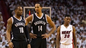 May 6, 2014; Miami, FL, USA; Brooklyn Nets guard Marcus Thornton (left) talks with guard Shaun Livingston (center) as Miami Heat guard Norris Cole (right) looks away during the first half in game one of the second round of the 2014 NBA Playoffs at American Airlines Arena. Mandatory Credit: Steve Mitchell-USA TODAY Sports