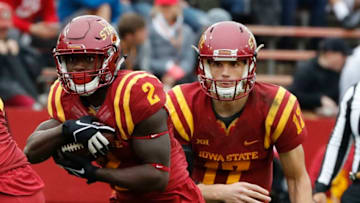AMES, IA - OCTOBER 14: Quarterback Kyle Kempt #17 of the Iowa State Cyclones hands the ball off to running back Mike Warren #2 of the Iowa State Cyclones in the second half of play against the Kansas Jayhawks at Jack Trice Stadium on October 14, 2017 in Ames, Iowa. The Iowa State Cyclones won 45-0 over the Kansas Jayhawks. (Photo by David K Purdy/Getty Images)