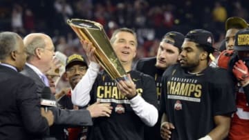 Jan 12, 2015; Arlington, TX, USA; Ohio State Buckeyes head coach Urban Meyer celebrates with the college football championship trophy after beating the Oregon Ducks in the 2015 CFP National Championship Game at AT&T Stadium. Mandatory Credit: Tommy Gilligan-USA TODAY Sports