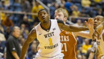 Jan 20, 2016; Morgantown, WV, USA; West Virginia Mountaineers forward Jonathan Holton (1) boxes out Texas Longhorns forward Connor Lammert (21) during the first half at the WVU Coliseum. Mandatory Credit: Ben Queen-USA TODAY Sports