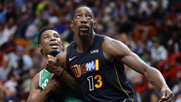 Bam Adebayo #13 of the Miami Heat and Aaron Nesmith #26 of the Boston Celtics battle for a rebound (Photo by Michael Reaves/Getty Images)