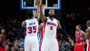 Feb 20, 2015; Auburn Hills, MI, USA; Detroit Pistons center Andre Drummond (0) high fives forward Cartier Martin (35) during the second quarter against the Chicago Bulls at The Palace of Auburn Hills. Mandatory Credit: Tim Fuller-USA TODAY Sports