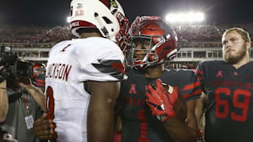 Nov 17, 2016; Houston, TX, USA; Louisville Cardinals quarterback Lamar Jackson (8) and Houston Cougars quarterback Greg Ward Jr. (1) shake hands after a game at TDECU Stadium. Mandatory Credit: Troy Taormina-USA TODAY Sports