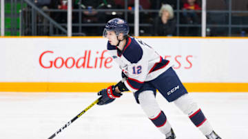 OTTAWA, ON - JANUARY 26: Saginaw Spirit Defenceman Mason Millman (12) skates with the puck during Ontario Hockey League action between the Saginaw Spirit and Ottawa 67's on January 26, 2020, at TD Place Arena in Ottawa, ON, Canada. (Photo by Richard A. Whittaker/Icon Sportswire via Getty Images)