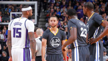 SACRAMENTO, CA - FEBRUARY 4: Stephen Curry #30, Draymond Green #23 and Kevin Durant #35 of the Golden State Warriors face off against DeMarcus Cousins #15 of the Sacramento Kings on February 4, 2017 at Golden 1 Center in Sacramento, California. NOTE TO USER: User expressly acknowledges and agrees that, by downloading and or using this photograph, User is consenting to the terms and conditions of the Getty Images Agreement. Mandatory Copyright Notice: Copyright 2017 NBAE (Photo by Rocky Widner/NBAE via Getty Images)