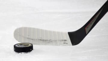 LAS VEGAS, NEVADA - JANUARY 16: A stick hits a puck on the ice during warmups before a game between the Anaheim Ducks and the Vegas Golden Knights at T-Mobile Arena on January 16, 2021 in Las Vegas, Nevada. The Golden Knights defeated the Ducks 2-1 in overtime. (Photo by Ethan Miller/Getty Images)