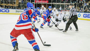 NEW YORK, NY - FEBRUARY 04: Puck slides back to New York Rangers right wing Mats Zuccarello (36) after faceoff between New York Rangers center Mika Zibanejad (93) and Los Angeles Kings center Anze Kopitar (11) during the Los Angeles Kings and New York Rangers NHL game on February 4, 2019, at Madison Square Garden in New York, NY. (Photo by John Crouch/Icon Sportswire via Getty Images)