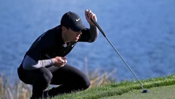 Feb 26, 2016; Palm Beach Gardens, FL, USA; Rory McIlroy lines up his putt on the 14th green during the second round of the Honda Classic at PGA National. Mandatory Credit: Peter Casey-USA TODAY Sports