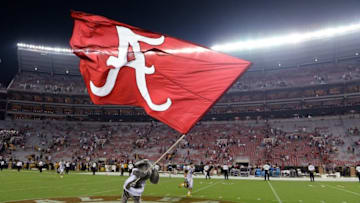 Sep 13, 2014; Tuscaloosa, AL, USA; Alabama Crimson Tide mascot Big Al waves the Alabama flag following their 52-12 victory against the Southern Miss Golden Eagles at Bryant-Denny Stadium. Mandatory Credit: John David Mercer-USA TODAY Sports