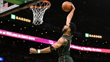 BOSTON, MASSACHUSETTS - DECEMBER 25: Jayson Tatum #0 of the Boston Celtics attempts a dunk against the Milwaukee Bucks during the second quarter at the TD Garden on December 25, 2022 in Boston, Massachusetts. NOTE TO USER: User expressly acknowledges and agrees that, by downloading and or using this photograph, User is consenting to the terms and conditions of the Getty Images License Agreement. (Photo by Brian Fluharty/Getty Images)