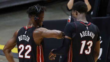 Jimmy Butler #22 of the Miami Heat laughs with Bam Adebayo #13 against the Utah Jazz (Photo by Michael Reaves/Getty Images)