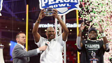 Dec 30, 2021; Atlanta, GA, USA; Michigan State Spartans head coach Mel Tucker holds the trophy after a victory against the Pittsburgh Panthers in the 2021 Peach Bowl at Mercedes-Benz Stadium. Mandatory Credit: Brett Davis-USA TODAY Sports