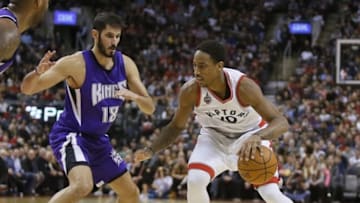 Dec 20, 2015; Toronto, Ontario, CAN; Toronto Raptors guard DeMar DeRozan (10) tries to get around Sacramento Kings forward Omri Casspi (18) at the Air Canada Centre. Sacramento defeated Toronto 104-94. Mandatory Credit: John E. Sokolowski-USA TODAY Sports