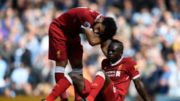 MANCHESTER, ENGLAND - SEPTEMBER 09: Mohamed Salah of Liverpool comforts Sadio Mane of Liverpool after he reacts to being sent off during the Premier League match between Manchester City and Liverpool at Etihad Stadium on September 9, 2017 in Manchester, England. (Photo by Stu Forster/Getty Images)