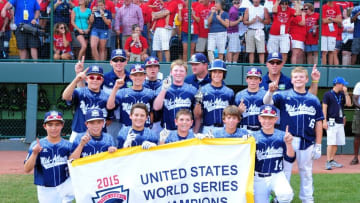 Aug 29, 2015; Williamsport, PA, USA; Mid-Atlantic Region players hold up a championship sign after beating the Southwest Region 3-2 at Howard J. Lamade Stadium. Mandatory Credit: Evan Habeeb-USA TODAY Sports