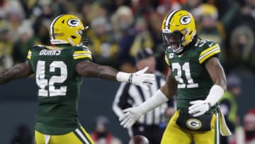 Jan 22, 2022; Green Bay, Wisconsin, USA; Green Bay Packers safety Adrian Amos (31) celebrates withj inside linebacker Oren Burks (42) after he intercepted the ball against the San Francisco 49ers during the NFC Divisional playoff football game at Lambeau Field. Mandatory Credit: Dan Powers/USA TODAY NETWORK
