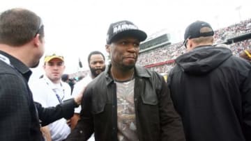 Feb 24, 2013; Daytona Beach, FL, USA; Recording artist 50 Cent walks down pit road before the 2013 Daytona 500 at Daytona International Speedway. Mandatory Credit: Jerry Lai-USA TODAY Sports