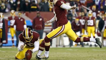 Dec 7, 2015; Landover, MD, USA; Washington Redskins kicker Dustin Hopkins (3) kicks a field goal against the Dallas Cowboys in the second quarter at FedEx Field. Mandatory Credit: Geoff Burke-USA TODAY Sports