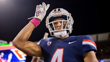 Oct 1, 2022; Tucson, Arizona, USA; Arizona Wildcats wide receiver Tetairoa McMillan (4) celebrates after scoring a touchdown against the Colorado Buffaloes in the first half at Arizona Stadium. Mandatory Credit: Ivan Pierre Aguirre-USA TODAY Sports