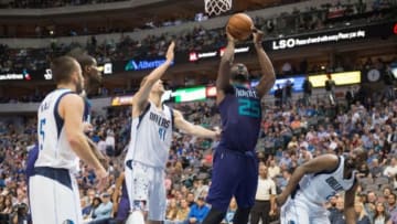 Nov 5, 2015; Dallas, TX, USA; Charlotte Hornets center Al Jefferson (25) shoots over Dallas Mavericks forward Dirk Nowitzki (41) and guard Raymond Felton (2) during the second half at the American Airlines Center. The Hornets defeat the Mavericks 108-94. Mandatory Credit: Jerome Miron-USA TODAY Sports
