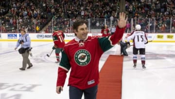 Feb 14, 2013; St. Paul, MN, USA; Minnesota Wild former forward Andrew Brunette (15) waves to the crowd prior to the game against the Colorado Avalanche at the Xcel Energy Center. The Avalanche defeated the Wild 4-3 in a shootout. Mandatory Credit: Brace Hemmelgarn-USA TODAY Sports