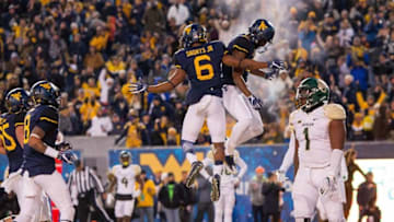 Dec 3, 2016; Morgantown, WV, USA; West Virginia Mountaineers wide receiver Daikiel Shorts (6) scores a touchdown and celebrates with Mountaineers wide receiver Gary Jennings (12) during the second quarter against the Baylor Bears at Milan Puskar Stadium. Mandatory Credit: Ben Queen-USA TODAY Sports