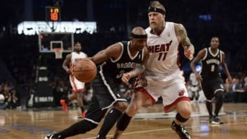 Jan 10, 2014; Brooklyn, NY, USA; Brooklyn Nets shooting guard Jason Terry (31) dribbles against Miami Heat power forward Chris Andersen (11) during the second half at Barclays Center. The Brooklyn Nets won the game 104-95 in double overtime. Mandatory Credit: Joe Camporeale-USA TODAY Sports