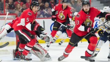 Jan 26, 2016; Ottawa, Ontario, CAN; Ottawa Senators defenseman Cody Ceci (5) and center Mika Zibanejad (93) chase the puck in the first period against the Buffalo Sabres at the Canadian Tire Centre. Mandatory Credit: Marc DesRosiers-USA TODAY Sports