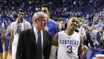 Jan 23, 2016; Lexington, KY, USA; Kentucky Wildcats guard Tyler Ulis (3) walks off the court with assistant coach John Robic after the game against the Vanderbilt Commodores at Rupp Arena. Kentucky defeated Vanderbilt 76-55. Mandatory Credit: Mark Zerof-USA TODAY Sports