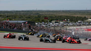 AUSTIN, TX - OCTOBER 21: Kimi Raikkonen of Finland driving the (7) Scuderia Ferrari SF71H leads Lewis Hamilton of Great Britain driving the (44) Mercedes AMG Petronas F1 Team Mercedes WO9 into turn one at the start during the United States Formula One Grand Prix at Circuit of The Americas on October 21, 2018 in Austin, United States. (Photo by Charles Coates/Getty Images)