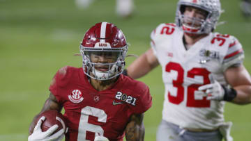 Jan. 11, 2021; Miami Gardens, Florida, USA; Alabama Crimson Tide wide receiver DeVonta Smith (6) catches a 42-yard touchdown behind Ohio State Buckeyes linebacker Tuf Borland (32) during the second quarter of the College Football Playoff National Championship at Hard Rock Stadium in Miami Gardens, Fla. Mandatory Credit: Kyle Robertson-USA TODAY Sports