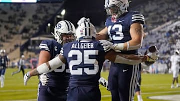 Oct 24, 2020; Provo, UT, USA; BYU running back Tyler Allgeier (25) celebrates with teammates after scoring against Texas State in the first half during an NCAA college football game Saturday, Oct. 24, 2020, in Provo, Utah. Mandatory Credit: Rick Bowmer/Pool Photo-USA TODAY NETWORK